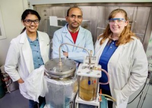 Brajendra Kumar Sharma (center) a senior research scientist at the Illinois Sustainable Technology Center at the U. of I., with research chemist Dheeptha Murali (left) and process chemist Jennifer Deluhery, converted plastic shopping bags into diesel fuel. (Photo: L. Brian Stauffer)